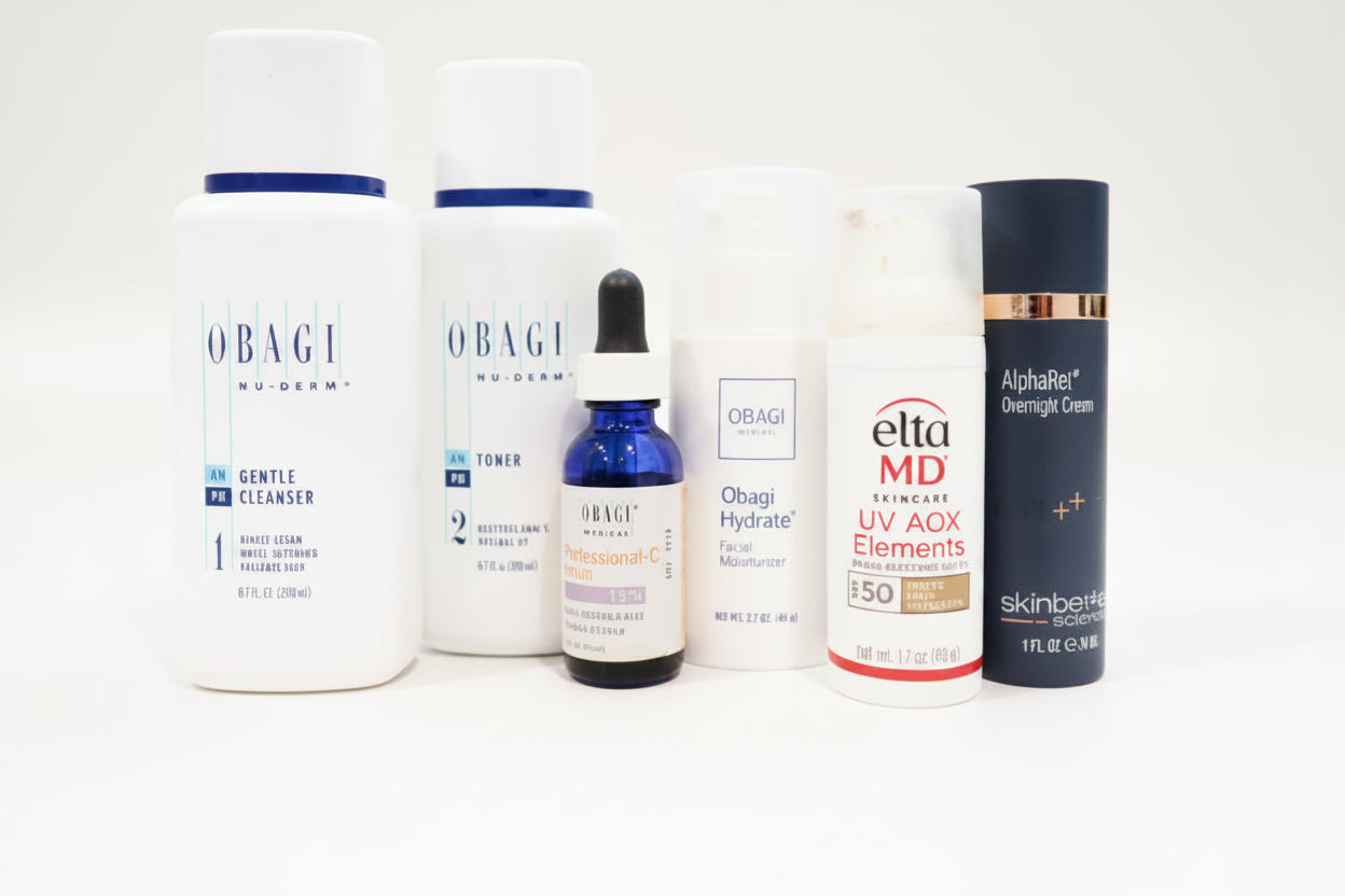 Collection of skincare products including Obagi and Elta MD on a white surface.