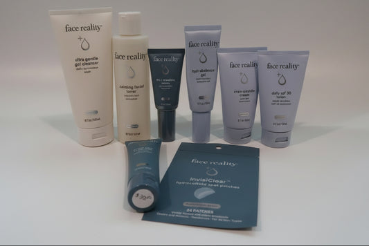 Collection of Face Reality skincare products on a white surface