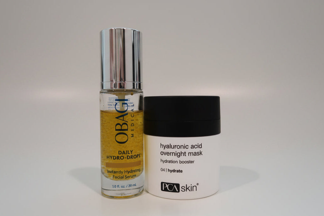 Two skincare products, an Obagi serum and a PCA skin mask, on a white surface with a blurred background.